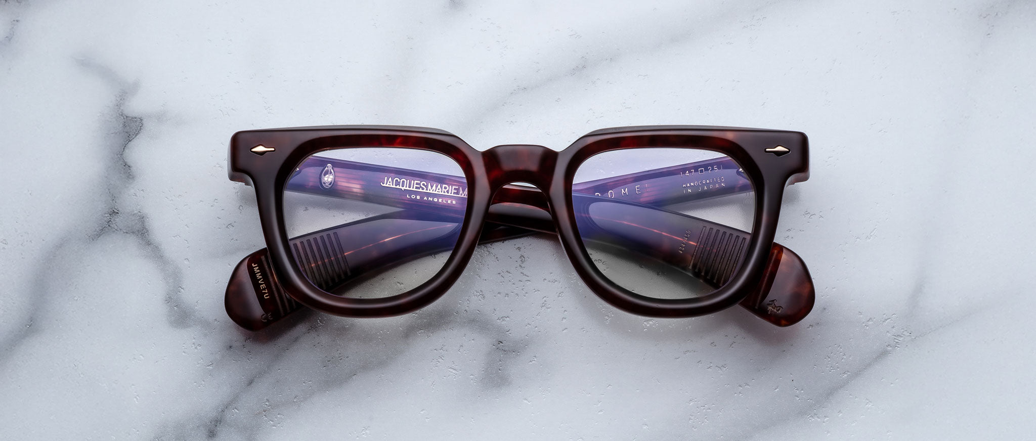 Jacques Marie Mage Vendome brown rectangular eyeglasses with purple-tinted UV lenses, top view.