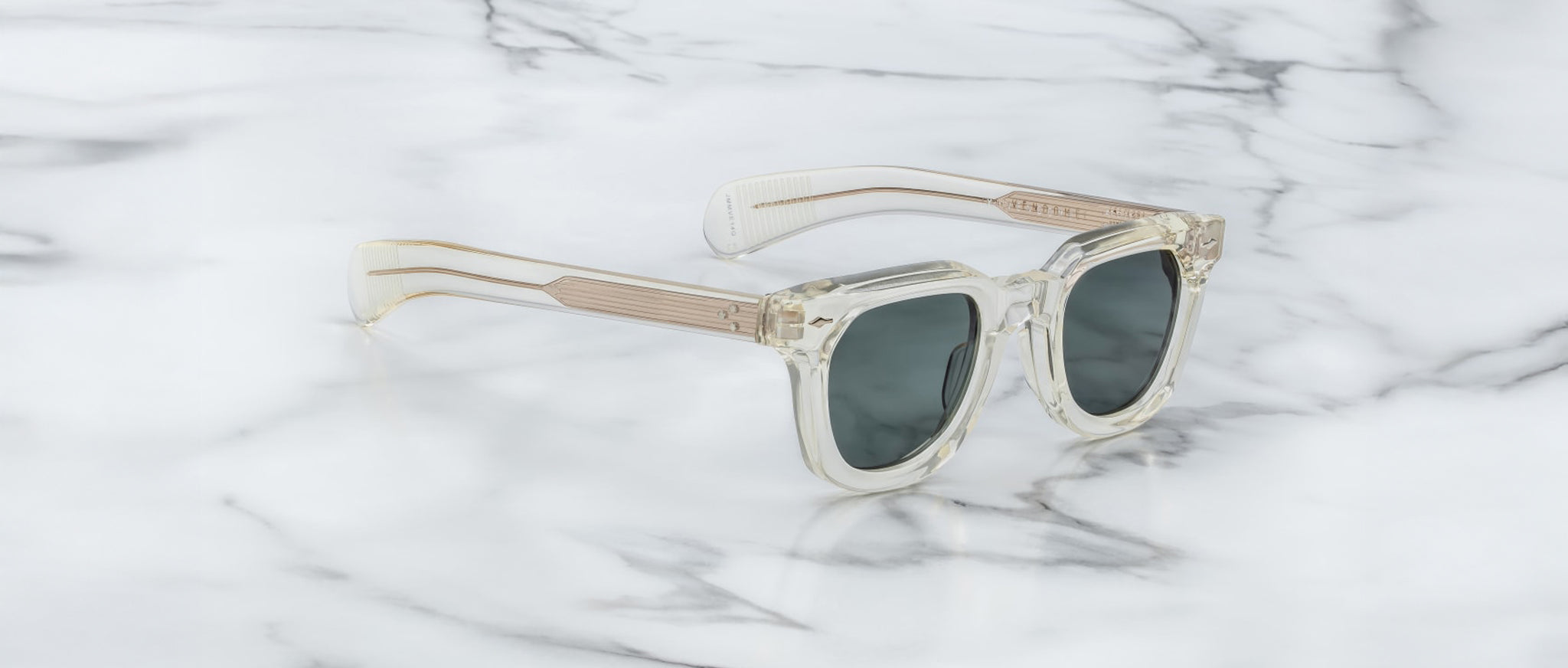 Jacques Marie Mage Vendome sunglasses with clear frames and gold accents, displayed front view.