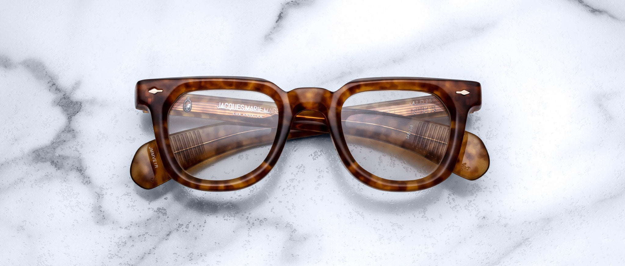 Jacques Marie Mage Vendome eyeglasses with thick brown tortoiseshell frames, viewed from above.