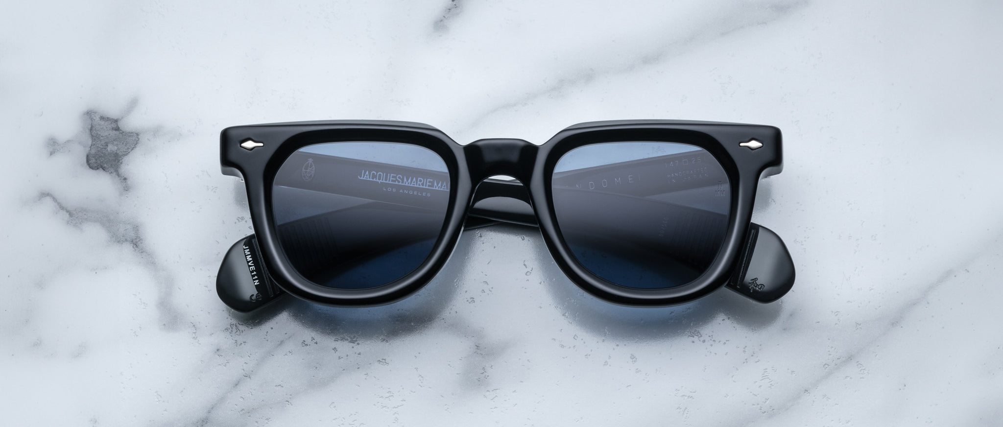 Jacques Marie Mage Vendome black rectangular sunglasses with dark lenses, shown from above.
