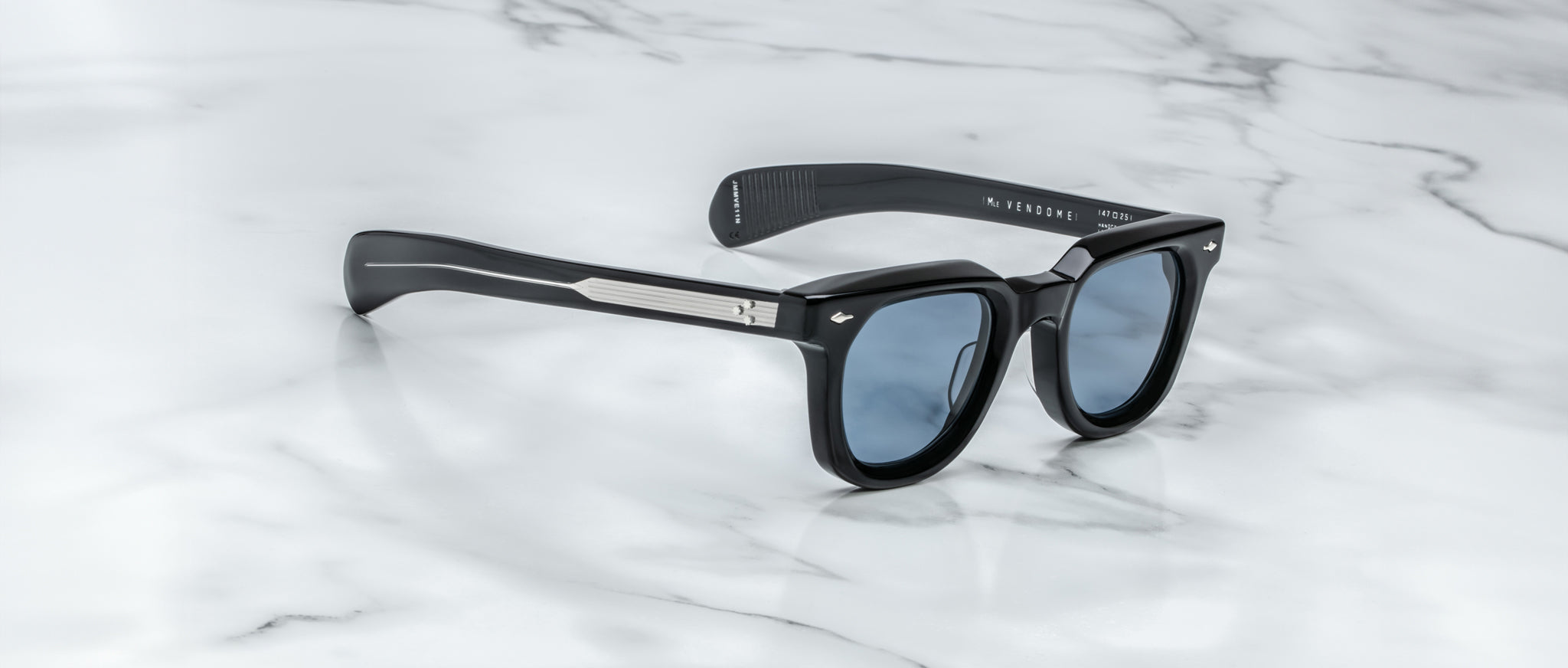 Jacques Marie Mage Vendome sunglasses with blue lenses, shown from above.