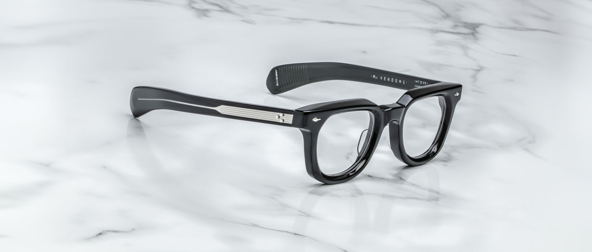Jacques Marie Mage Vendome black rectangular eyeglasses with silver accents, top view.