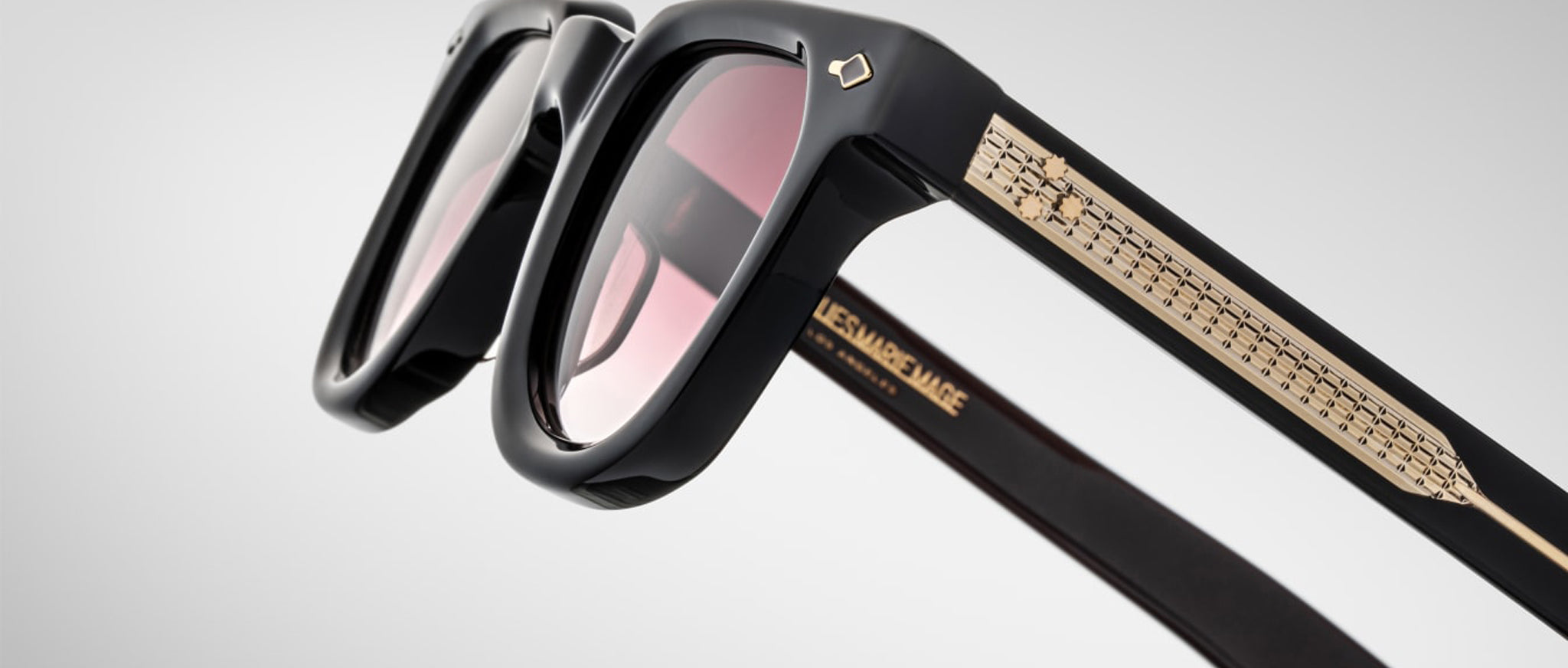 Jacques Marie Mage Vendome sunglasses, shown from the side, have gold-detailed arms and UV-protected tinted lenses.