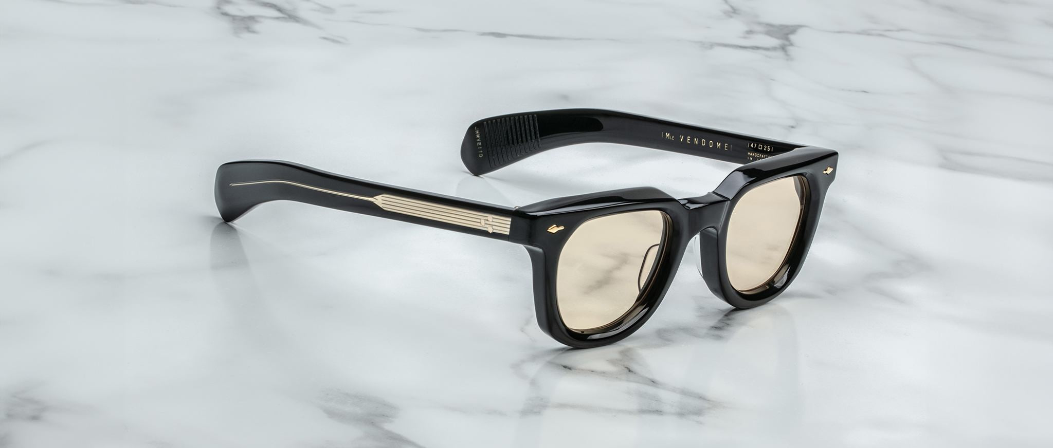 Jacques Marie Mage Vendome black rectangular sunglasses with gold accents and mirrored light brown lenses, front view.