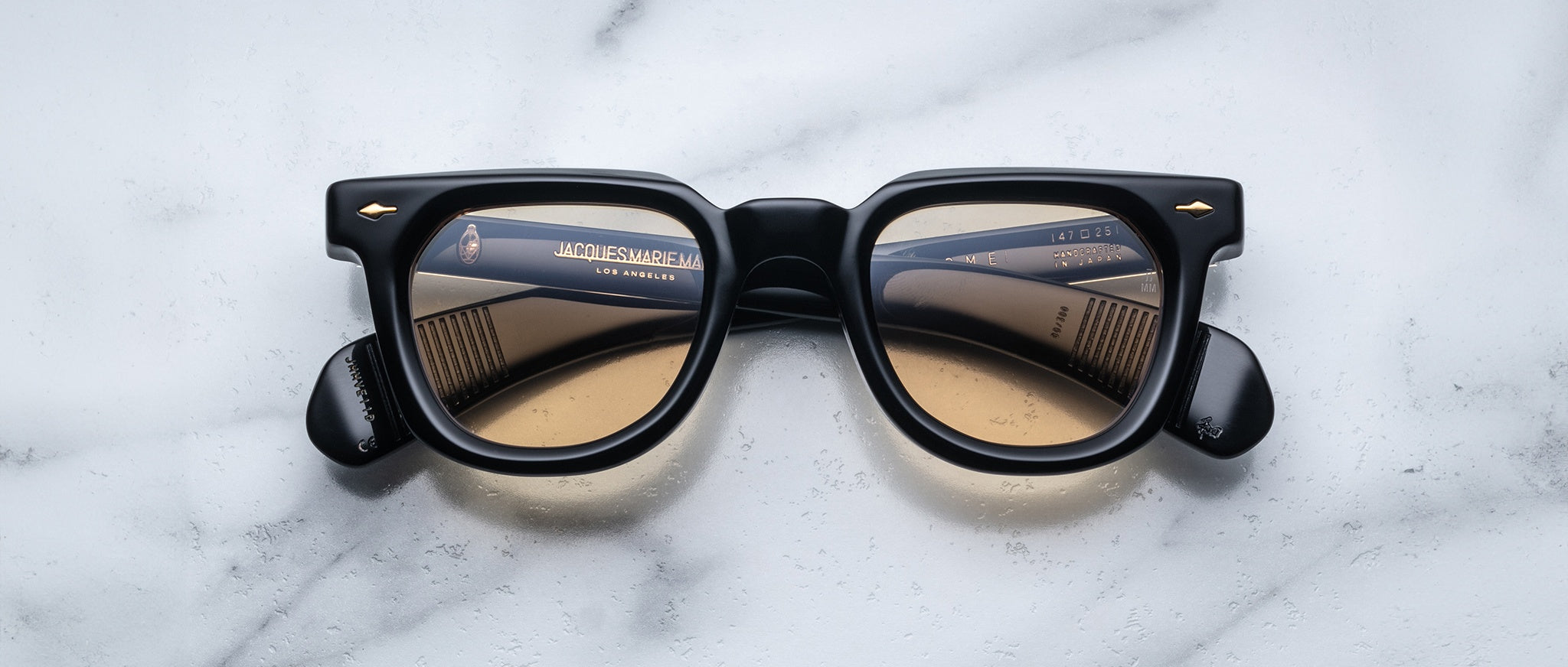 Jacques Marie Mage Vendome black square eyeglasses with brown gradient lenses, side view showing brand details on the arms.