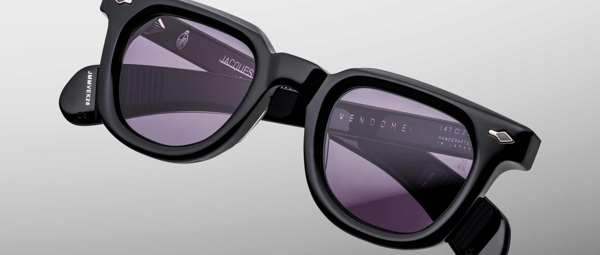 Jacques Marie Mage Vendome sunglasses, black square-frame with dark lenses, logo visible on inner arms, front view.