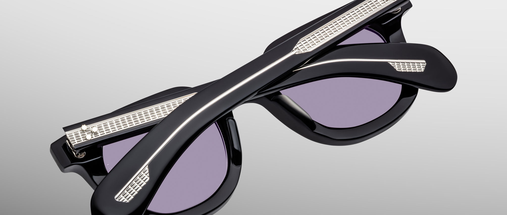 Jacques Marie Mage Vendome black retro sunglasses with purple lenses, folded, top-down angle.