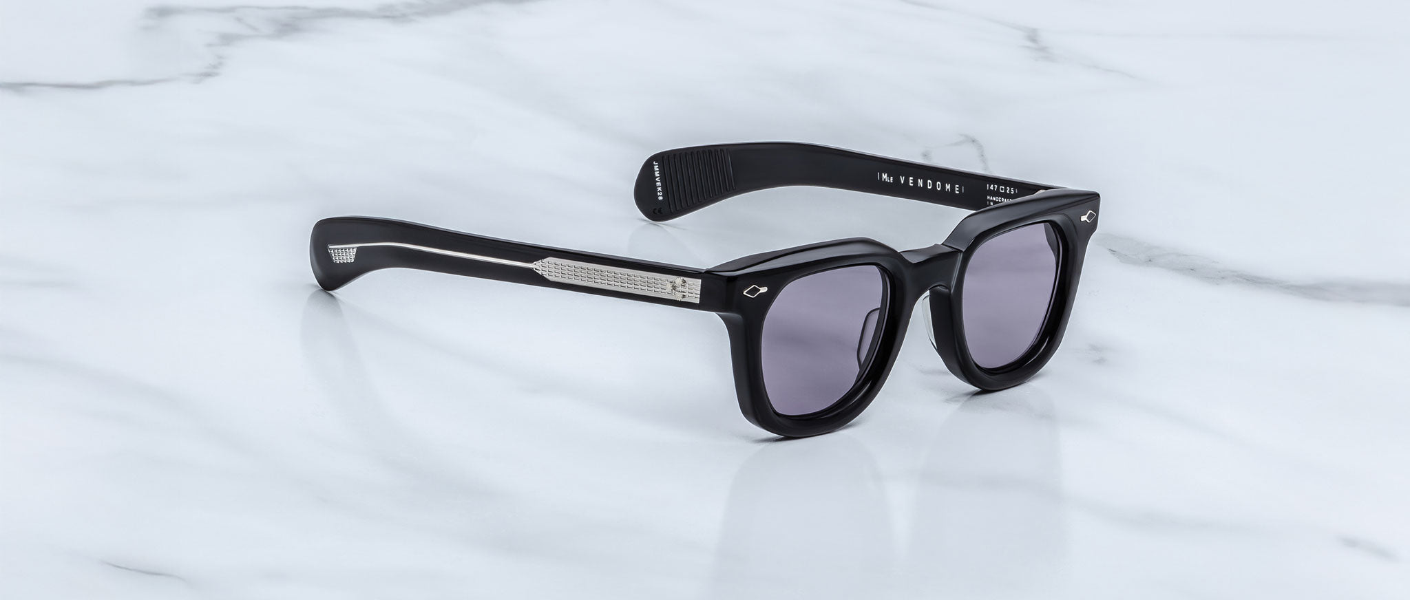 Jacques Marie Mage Vendome rectangular sunglasses with dark lenses, top view.