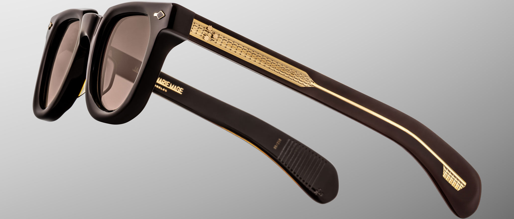 Jacques Marie Mage Vendome sunglasses with gold-accented arms, shown from the side to highlight frame and detailing.