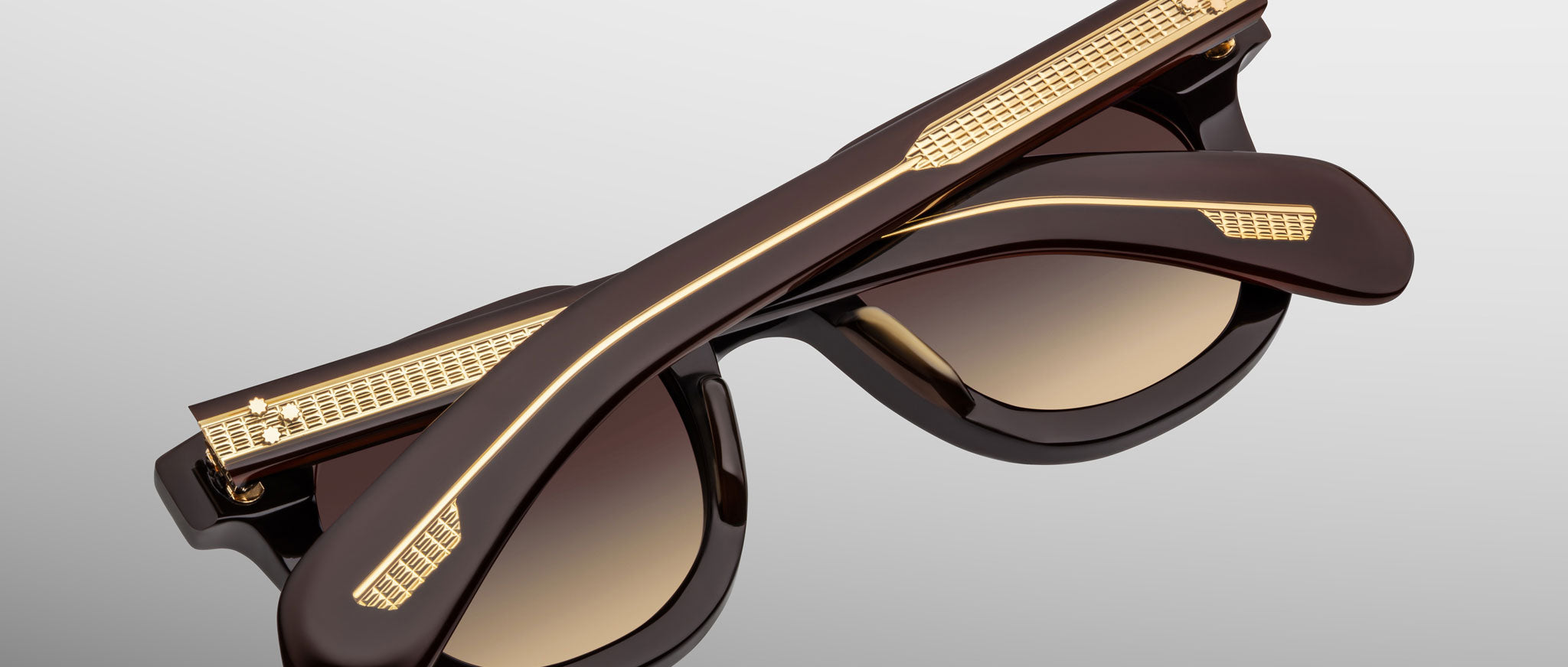 Jacques Marie Mage Vendome brown sunglasses with gold accents, front view.
