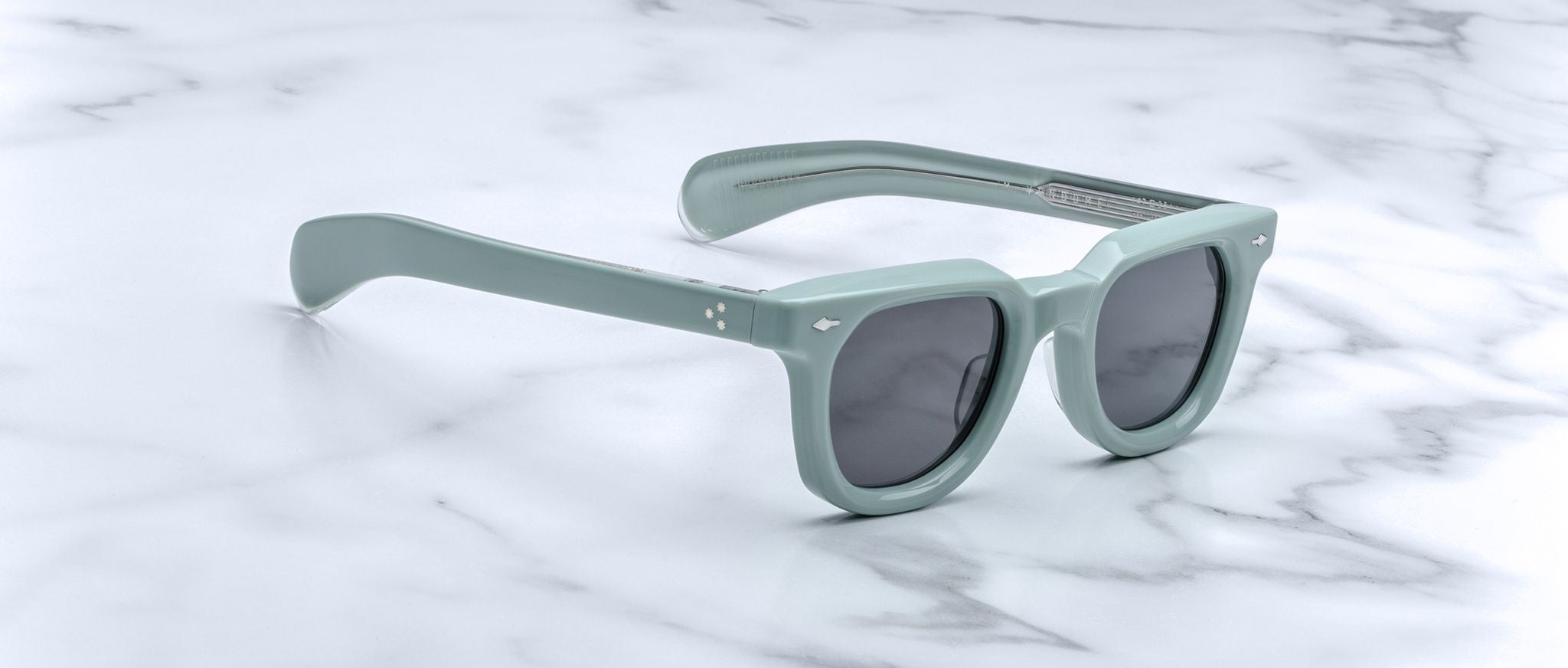 Jacques Marie Mage Vendome pale green rectangular sunglasses with UV lenses, front view.