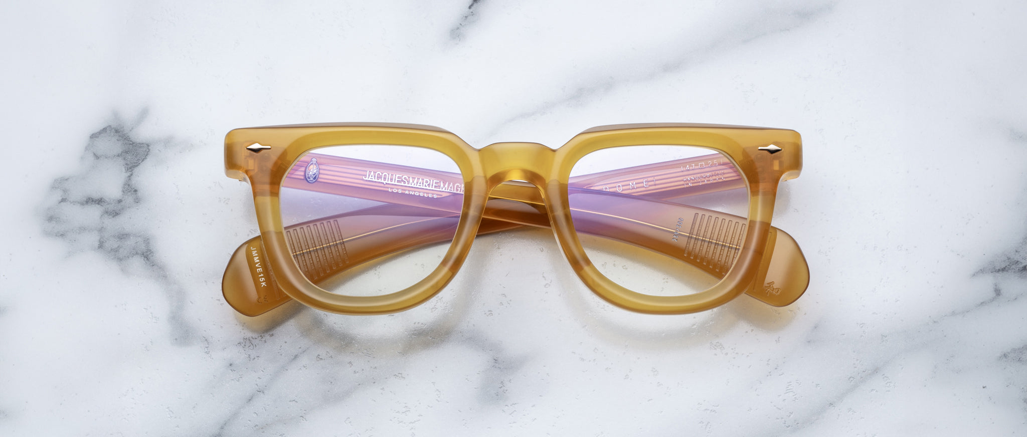 Jacques Marie Mage Vendome light brown eyeglasses with purple lenses, top view.