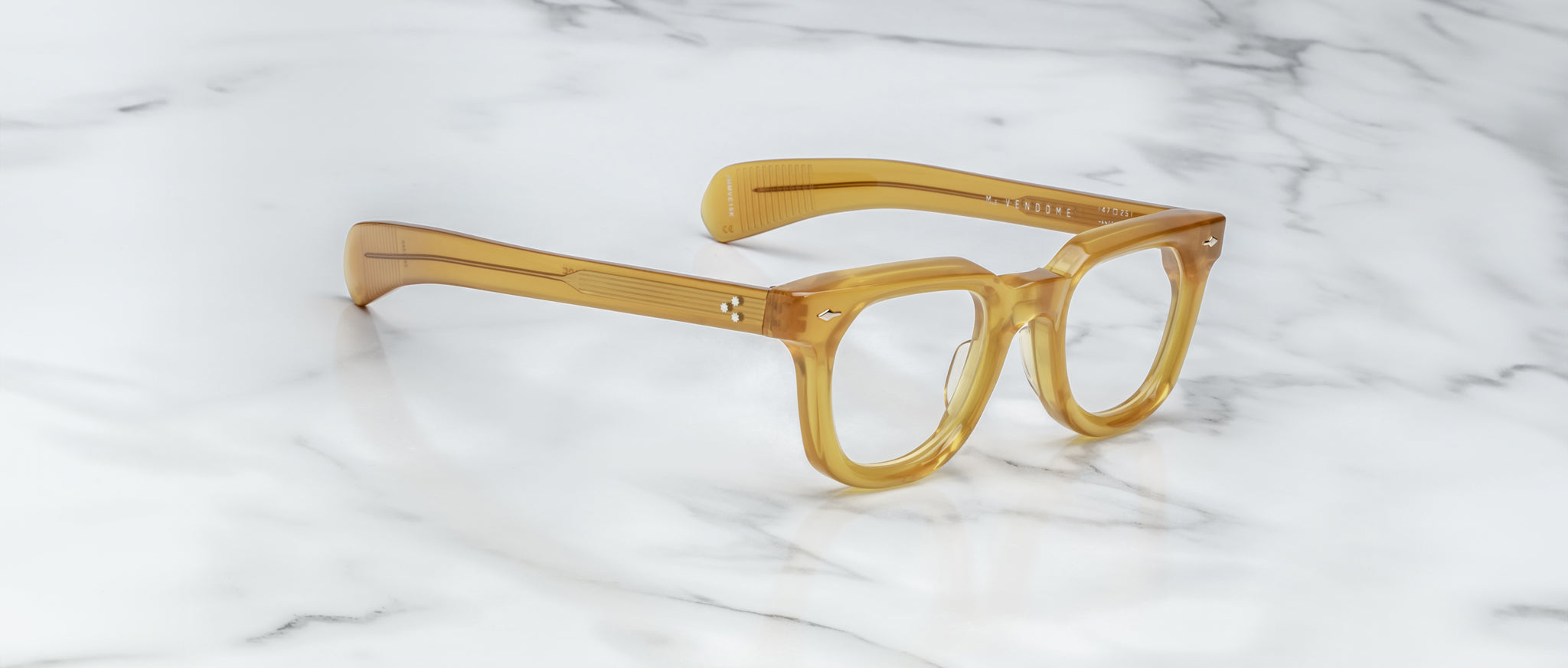 Jacques Marie Mage Vendome amber acetate eyeglasses with thick frames shown from above.