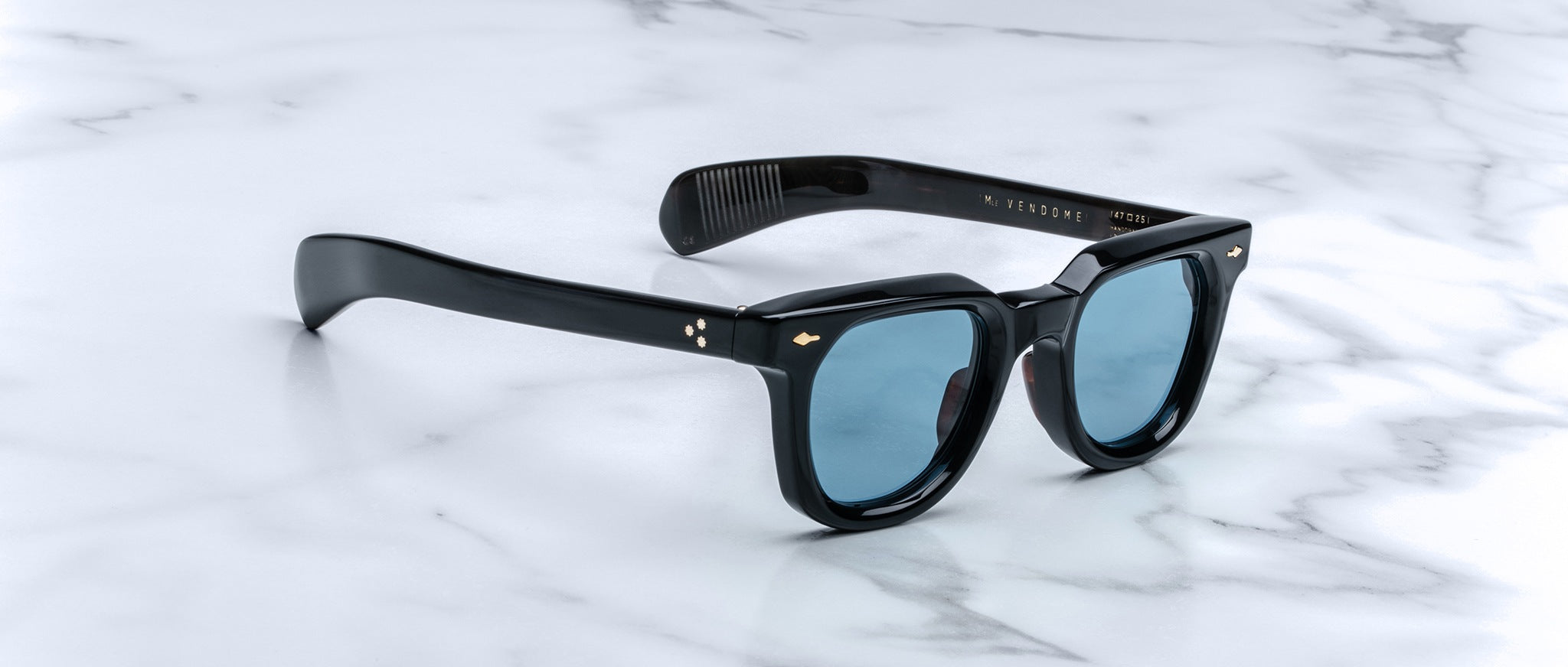 Jacques Marie Mage Vendome black rectangular sunglasses with blue lenses, top view.
