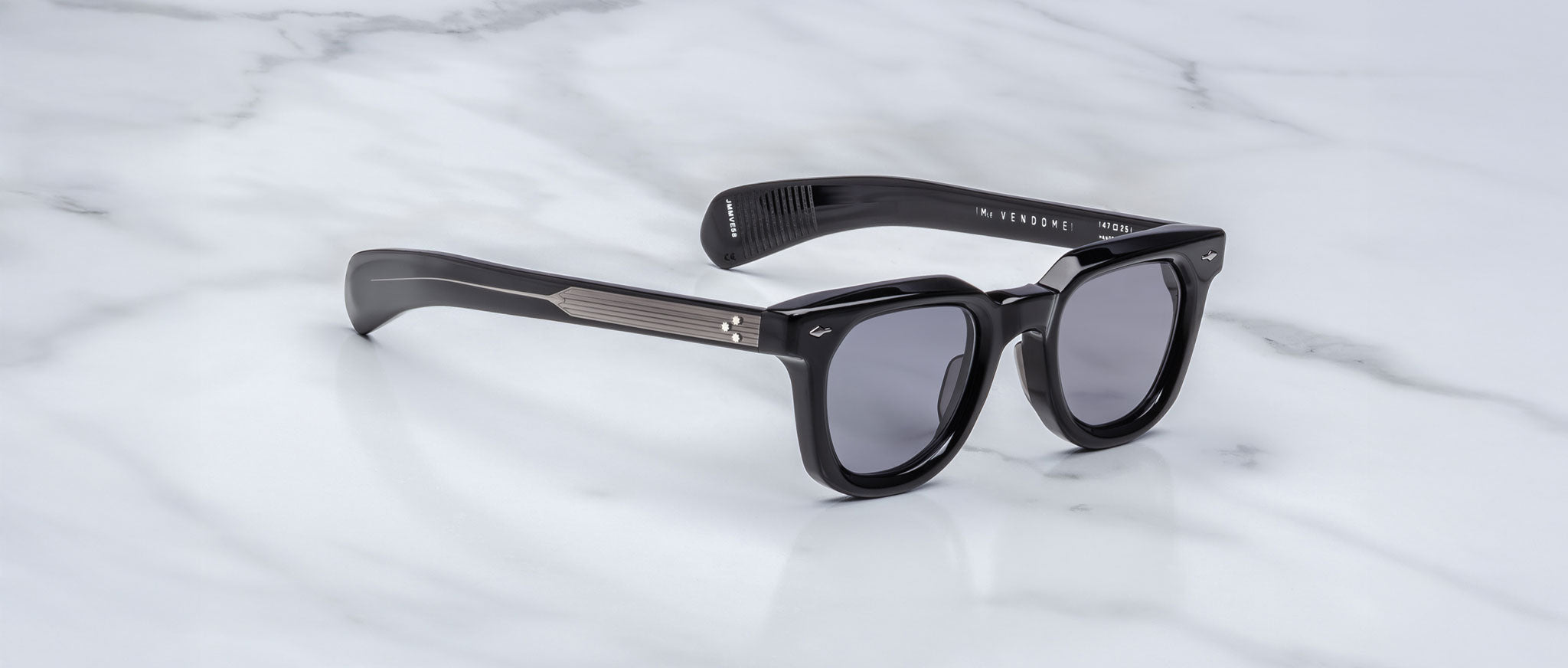 Jacques Marie Mage Vendome black rectangular sunglasses with UV lenses and thick arms, shown from above.