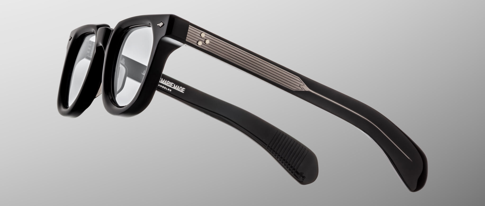 Jacques Marie Mage Vendome eyeglasses, black rectangular frames with clear lenses and textured metal arms, front angle view.