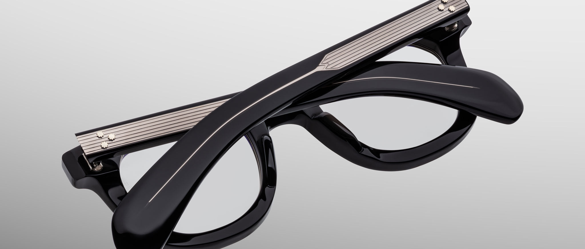 Jacques Marie Mage Vendome black eyeglasses with metallic accents, shown folded from above.