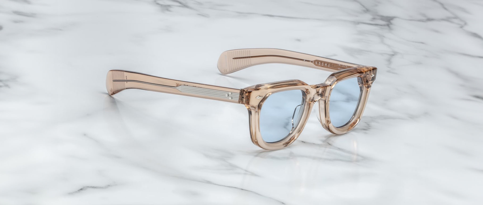 Jacques Marie Mage Vendome eyeglasses, transparent beige frame, blue lenses, anti-glare coating, front view.
