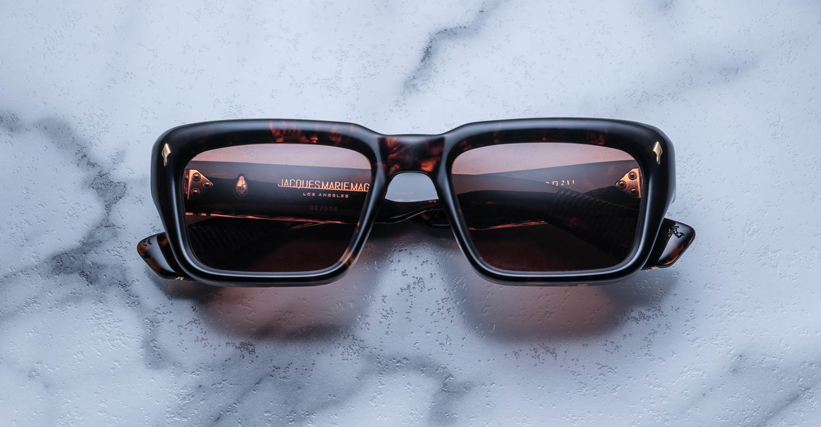 Jacques Marie Mage Walker sunglasses with dark lenses, viewed from above.