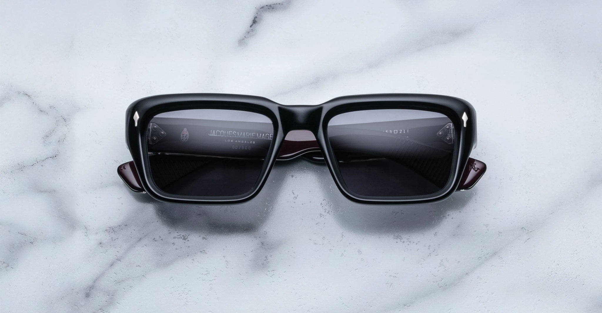 Jacques Marie Mage Walker sunglasses with dark lenses, viewed from above, displayed on a flat surface.