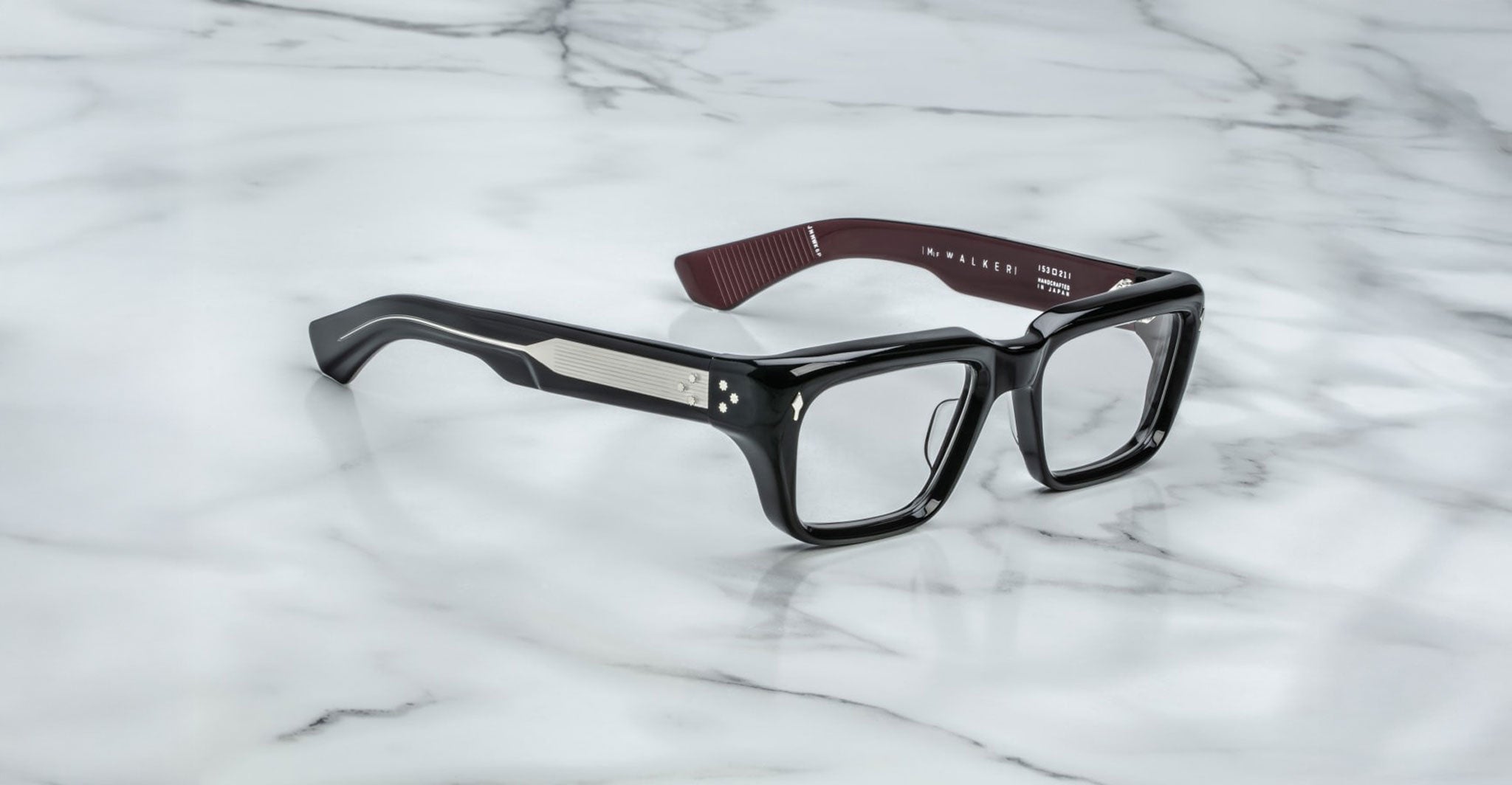 Jacques Marie Mage Walker black rectangular eyeglasses with thick frames and silver accents, front view.