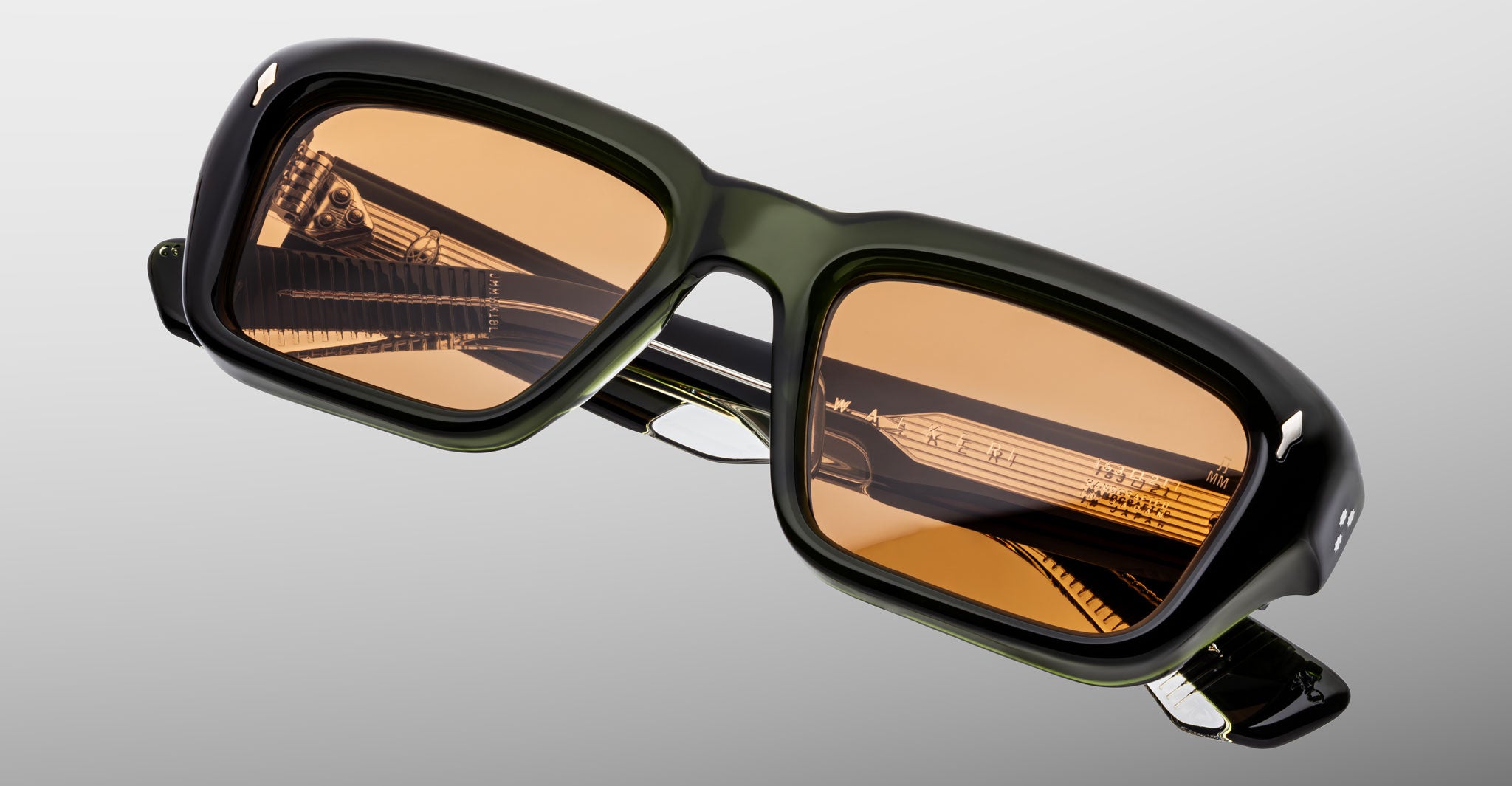 Jacques Marie Mage Walker sunglasses, rectangular black frames with brown-tinted lenses, front view.