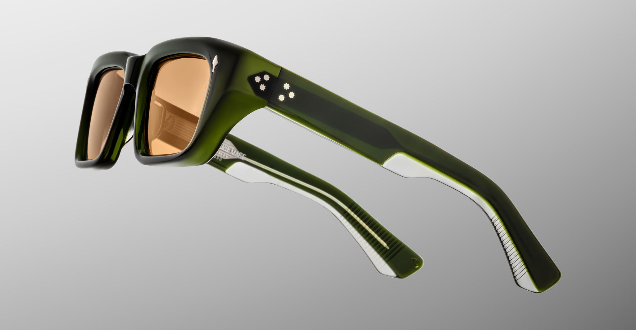 Jacques Marie Mage Walker sunglasses, green rectangular frames with brown lenses and star details at temples, front view.