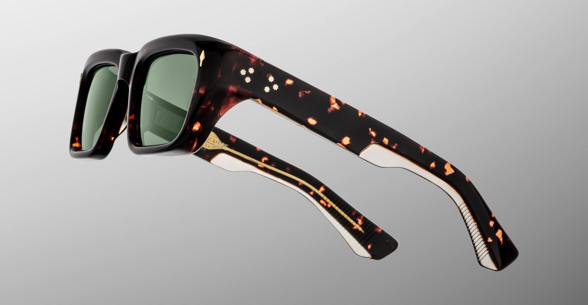 Side view close-up of Jacques Marie Mage Walker round tortoiseshell sunglasses with green lenses.