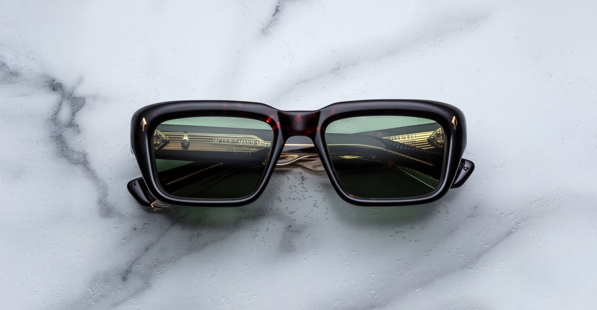 Jacques Marie Mage Walker black sunglasses with dark lenses shown from above, highlighting frame shape and brand.