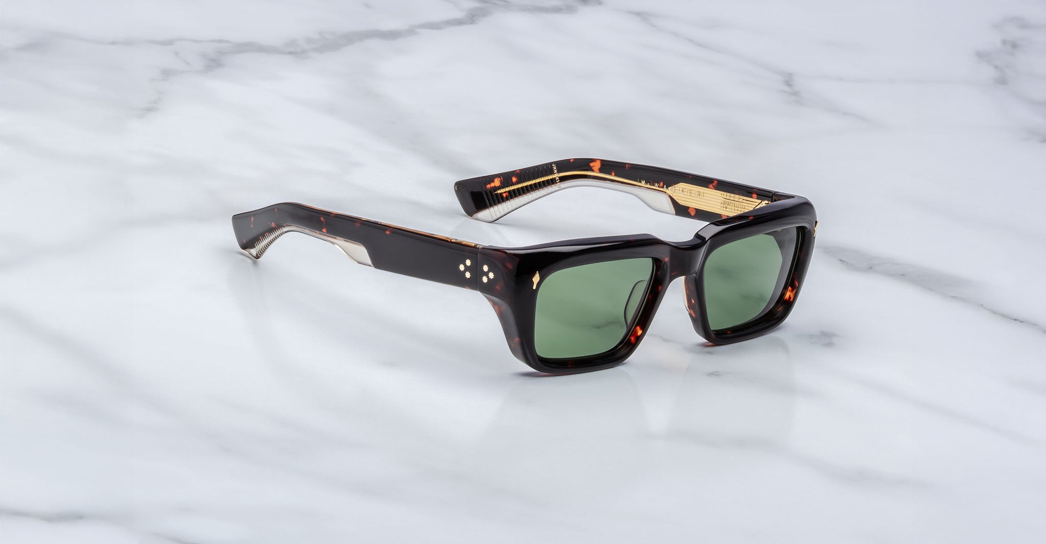 Jacques Marie Mage Walker sunglasses with green lenses, shown from above.