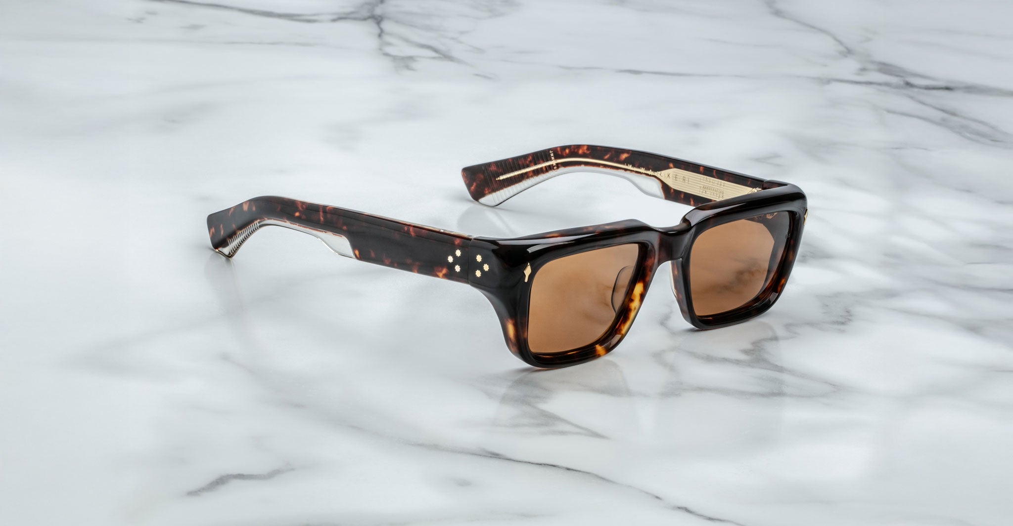 Jacques Marie Mage Walker sunglasses with brown lenses, shown from above, display the frame design and lens color clearly.