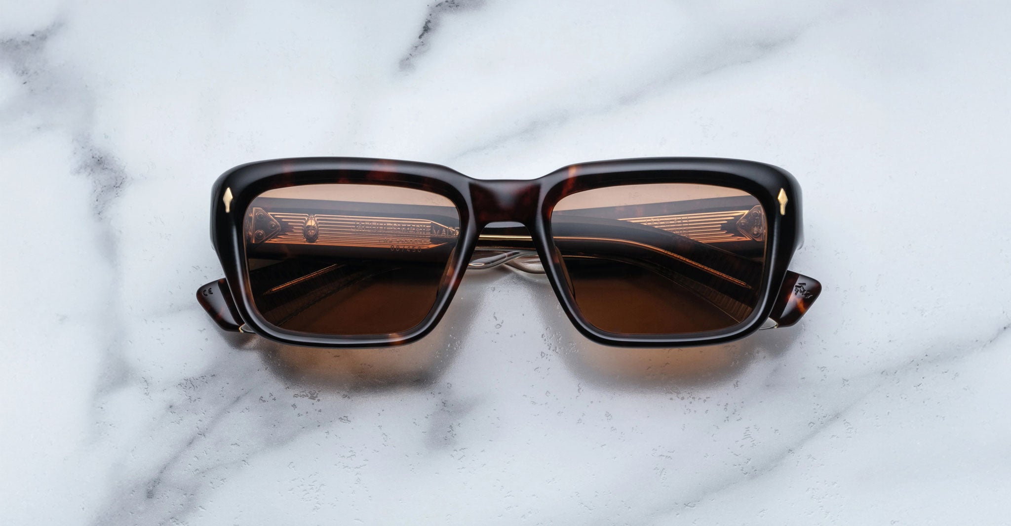 Jacques Marie Mage Walker rectangular tortoiseshell sunglasses with brown UV-protective lenses, top-down view.