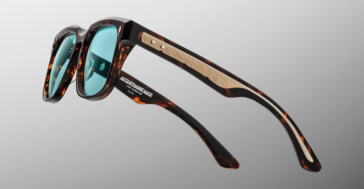 Jacques Marie Mage Wesley sunglasses, tortoiseshell frame, teal lenses, gold accents, front view.