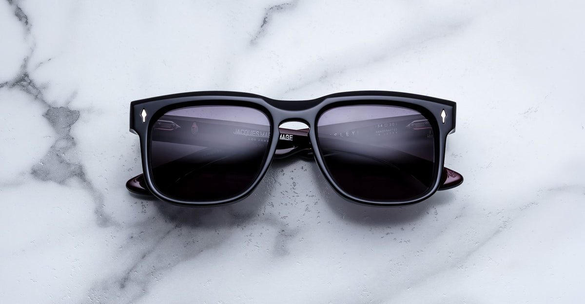 Jacques Marie Mage Wesley black polarized sunglasses with dark lenses, top view, showing front frame and temples.
