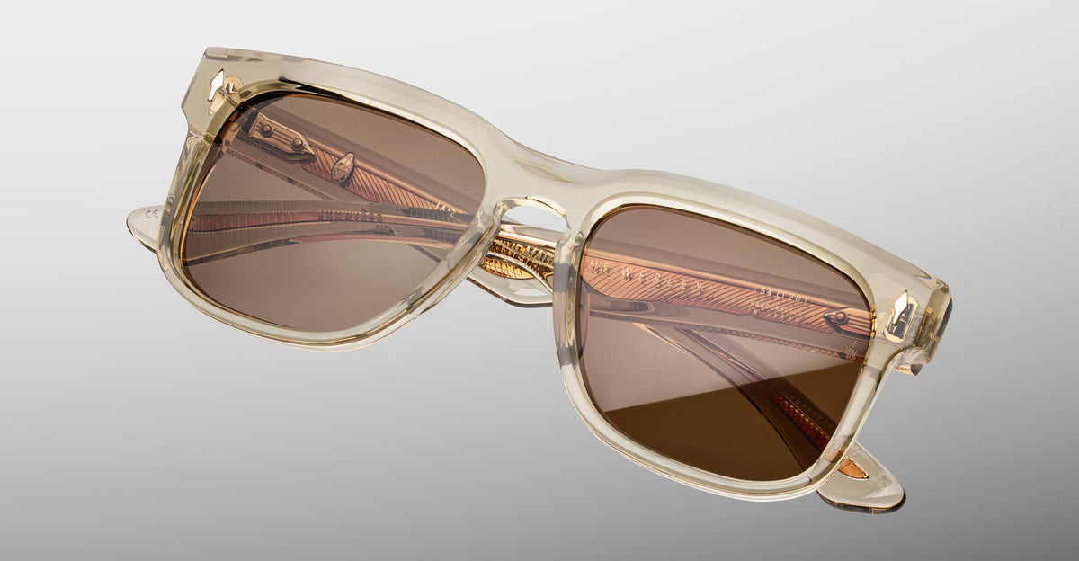 Jacques Marie Mage Wesley sunglasses, translucent beige frame, brown lenses, gold inner arms, front angle view.