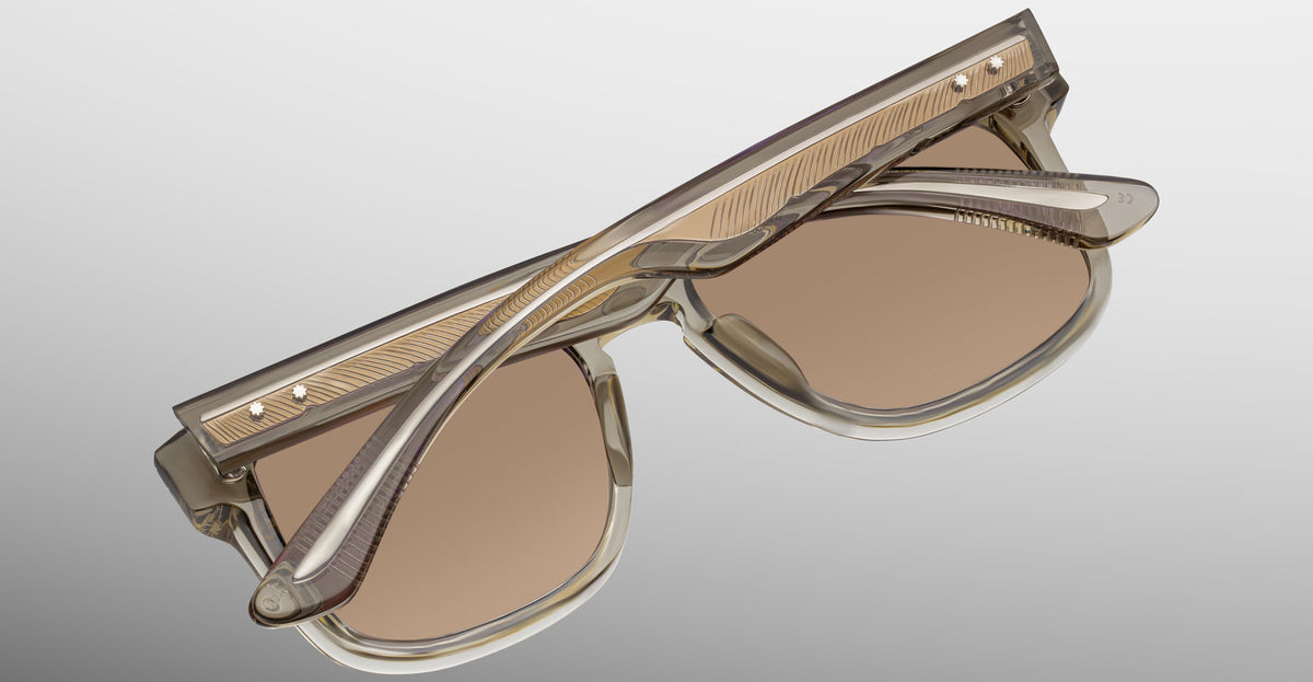 Jacques Marie Mage Wesley sunglasses displayed upside down, focusing on the arms and top from a top-down angle.