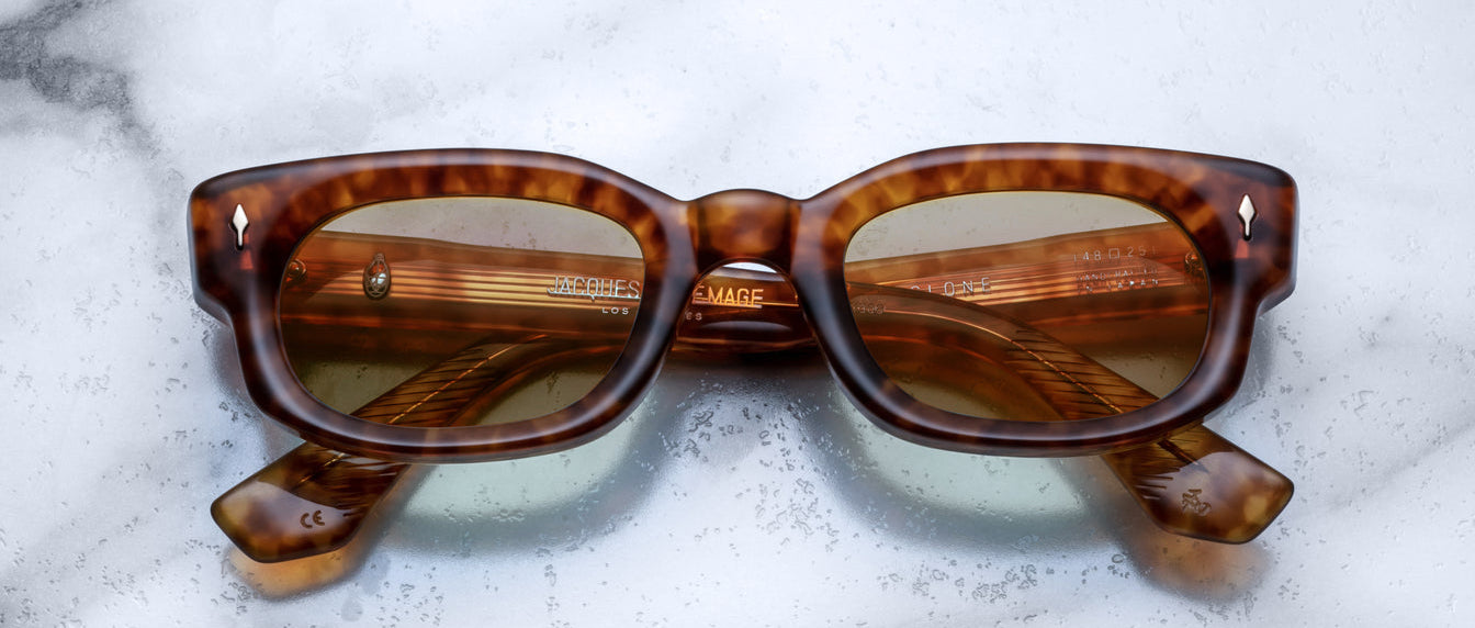 Jacques Marie Mage Whiskeyclone tortoiseshell rectangular sunglasses with green UV-protected lenses, front view.