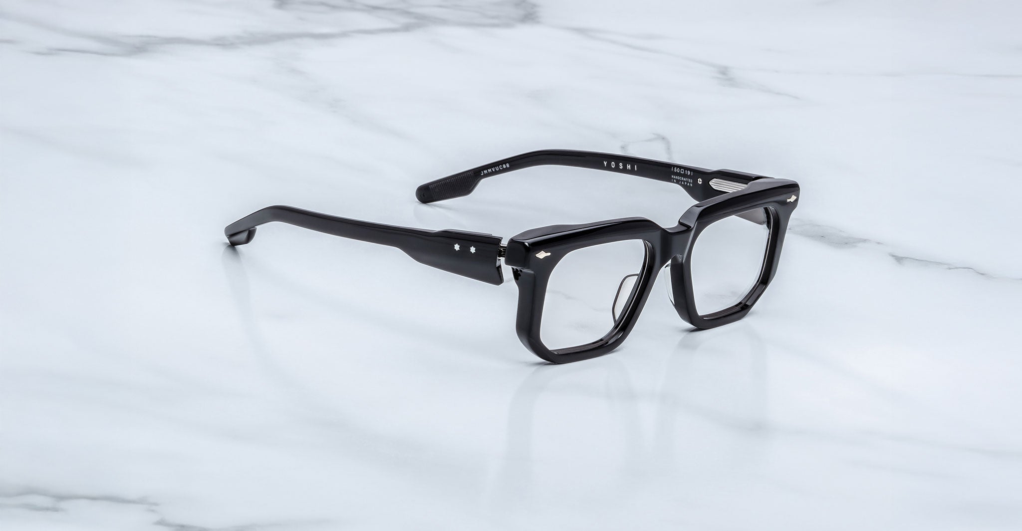 Jacques Marie Mage Yoshi Black acetate spectacles angled view with structured front and medium fit design