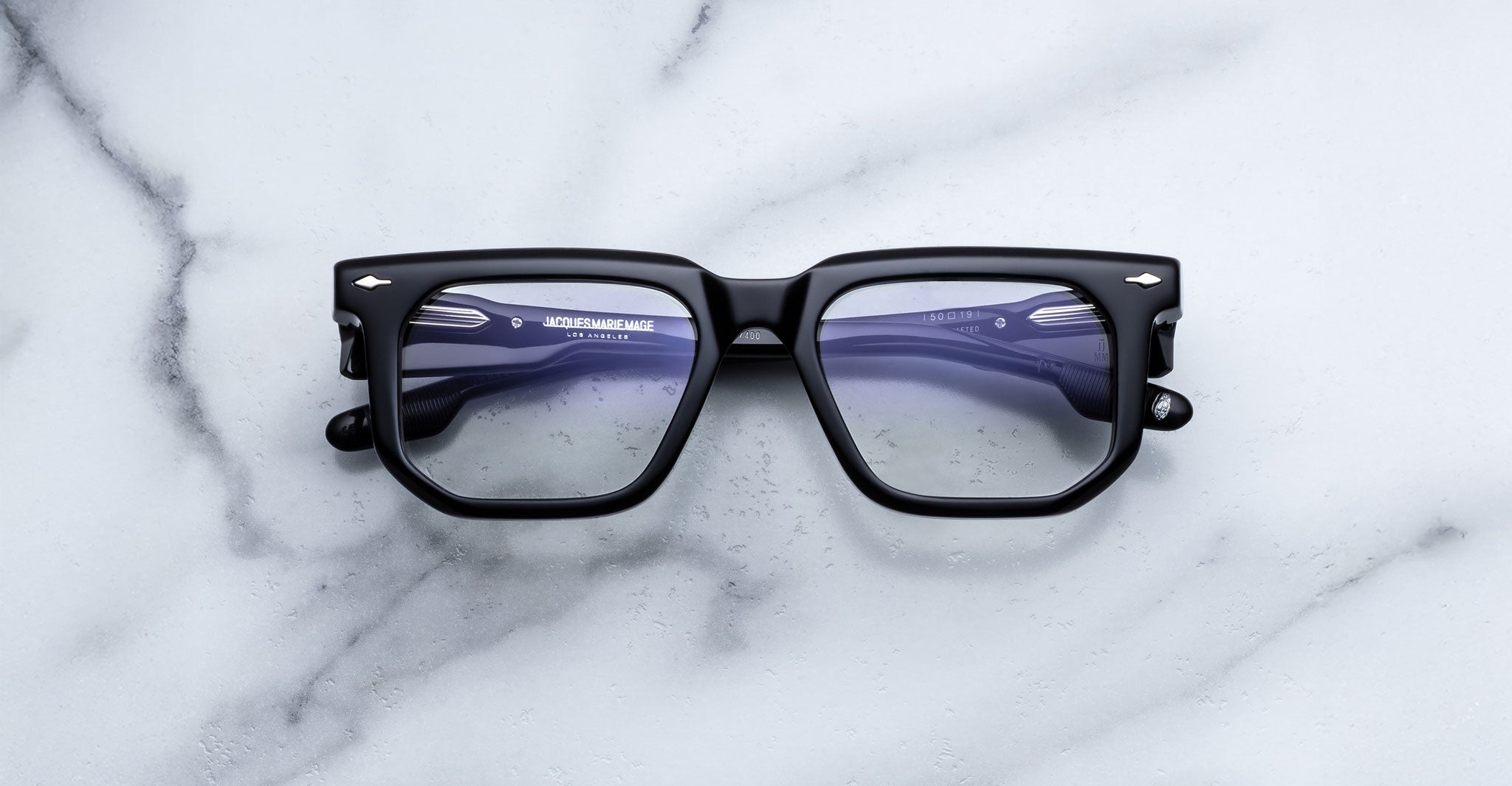 Jacques Marie Mage Yoshi in Black optical frame featuring bold geometric lenses and sculpted acetate front