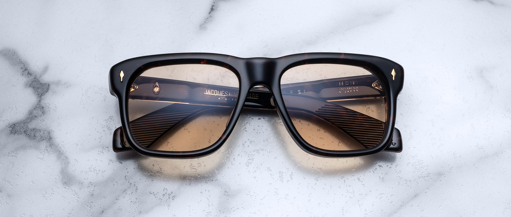 Jacques Marie Mage Yves square tortoiseshell sunglasses with brown gradient lenses, top down angle.