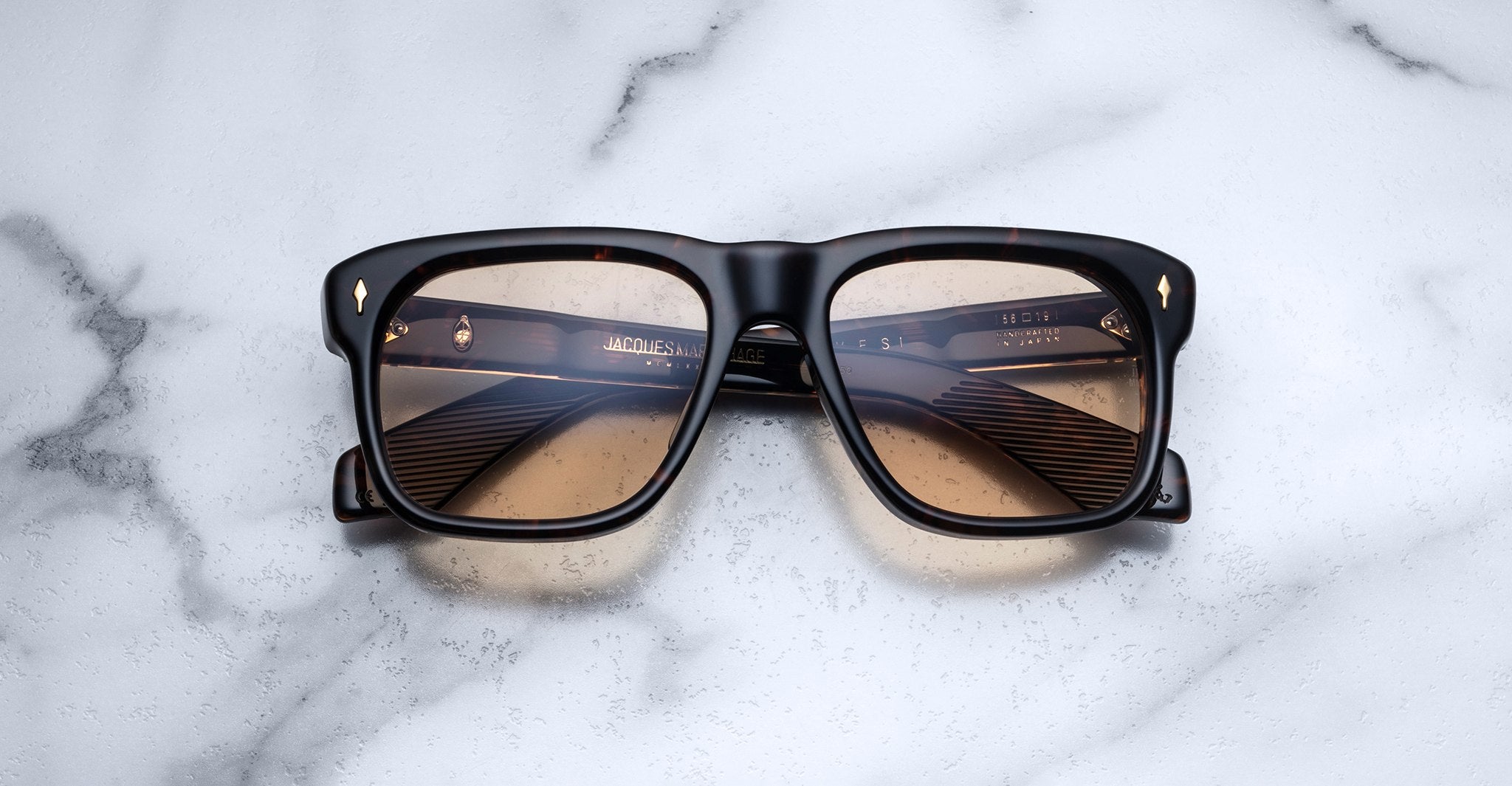 Jacques Marie Mage Yves square tortoiseshell sunglasses with brown gradient lenses, top down angle.