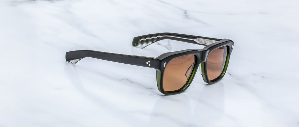 Jacques Marie Mage Yves black rectangular sunglasses with brown lenses, top view.