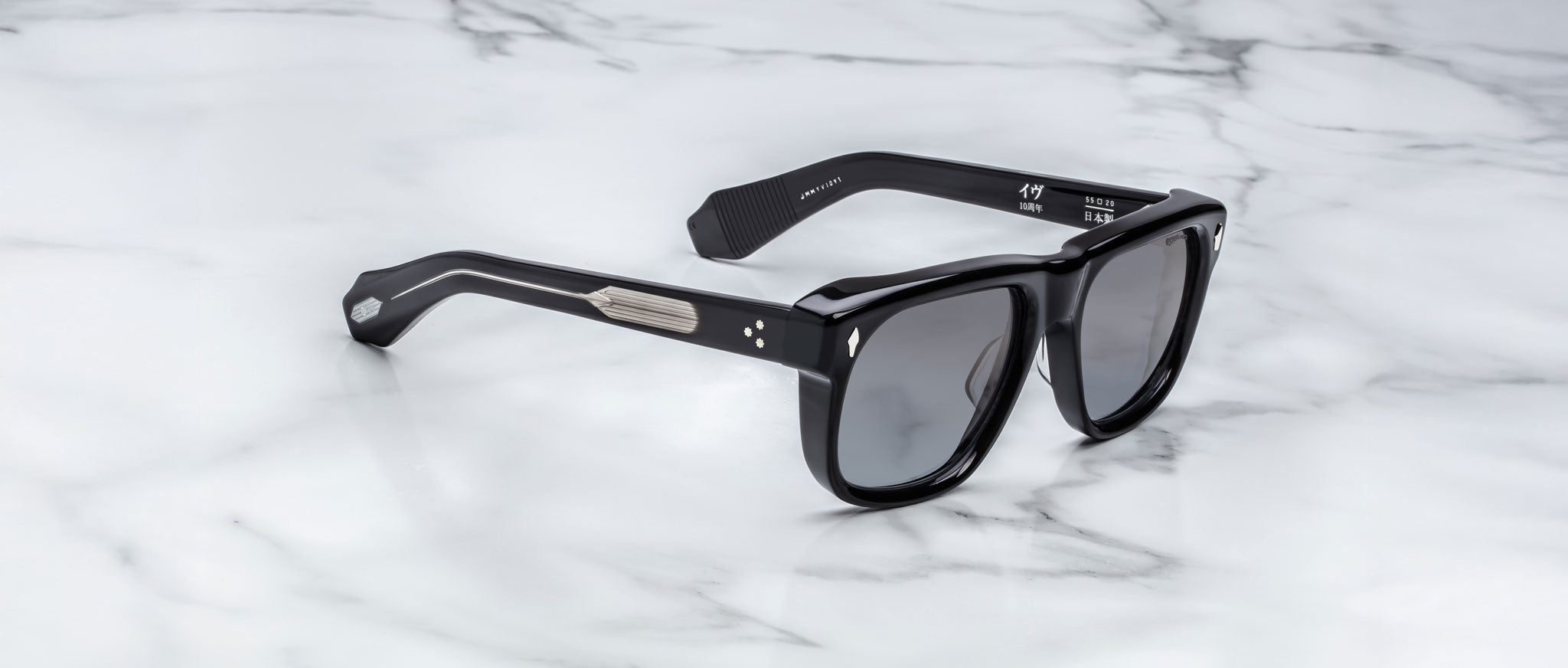 Jacques Marie Mage Yves black rectangular sunglasses with thick frames, shown from above.