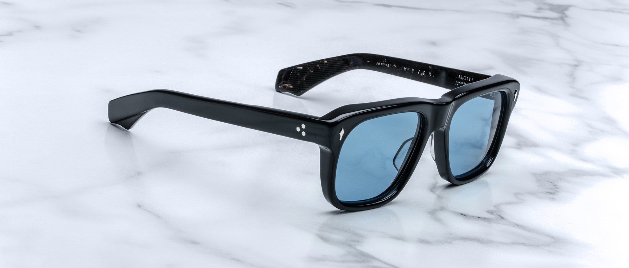 Jacques Marie Mage Yves black rectangular sunglasses with blue lenses, front view.