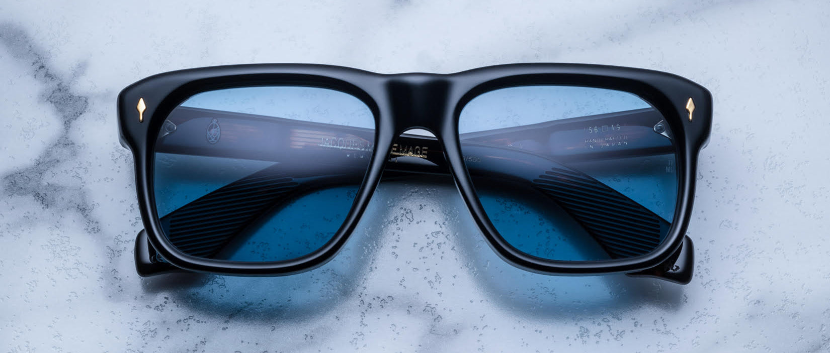 Jacques Marie Mage Yves black rectangular eyeglasses with blue-light lenses, top view.