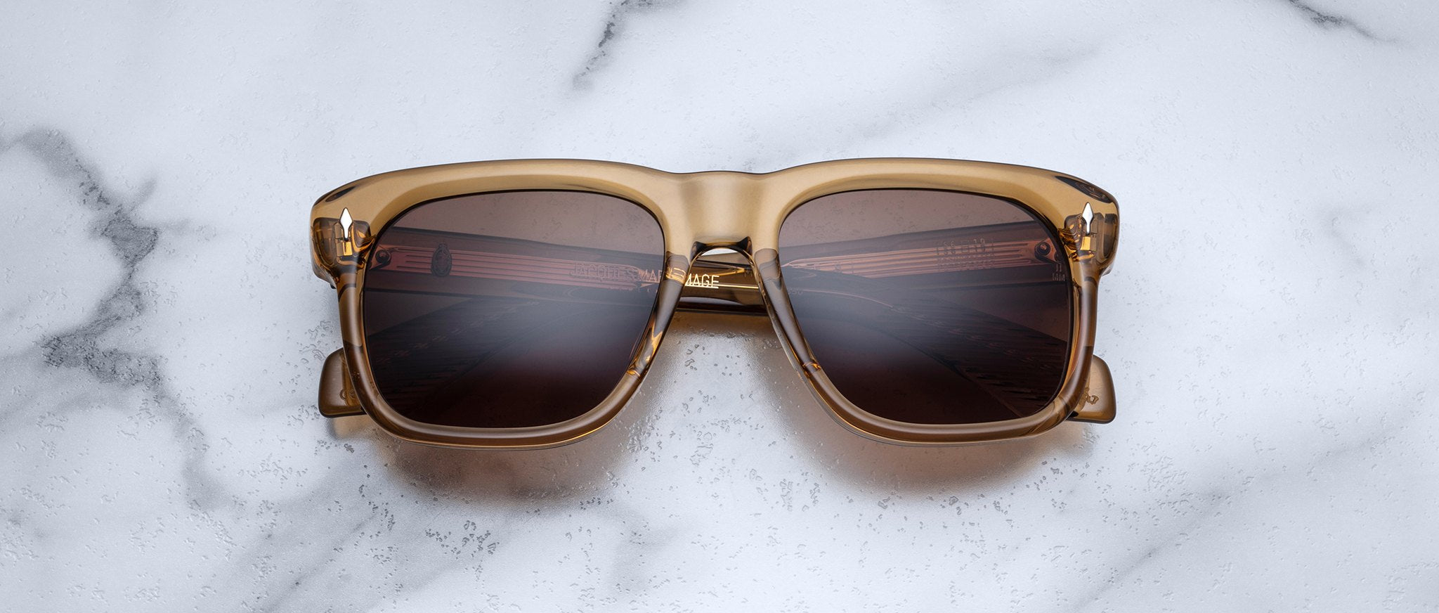 Jacques Marie Mage Yves brown square sunglasses with UV lenses, top view showing frame details.
