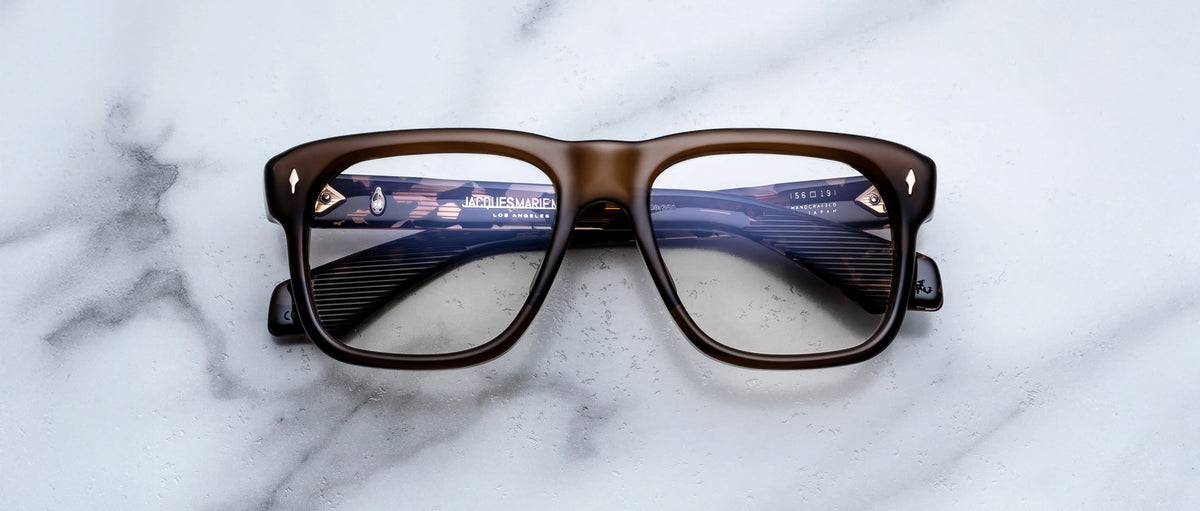 Jacques Marie Mage Yves brown rectangular eyeglasses with thick frames, front view.