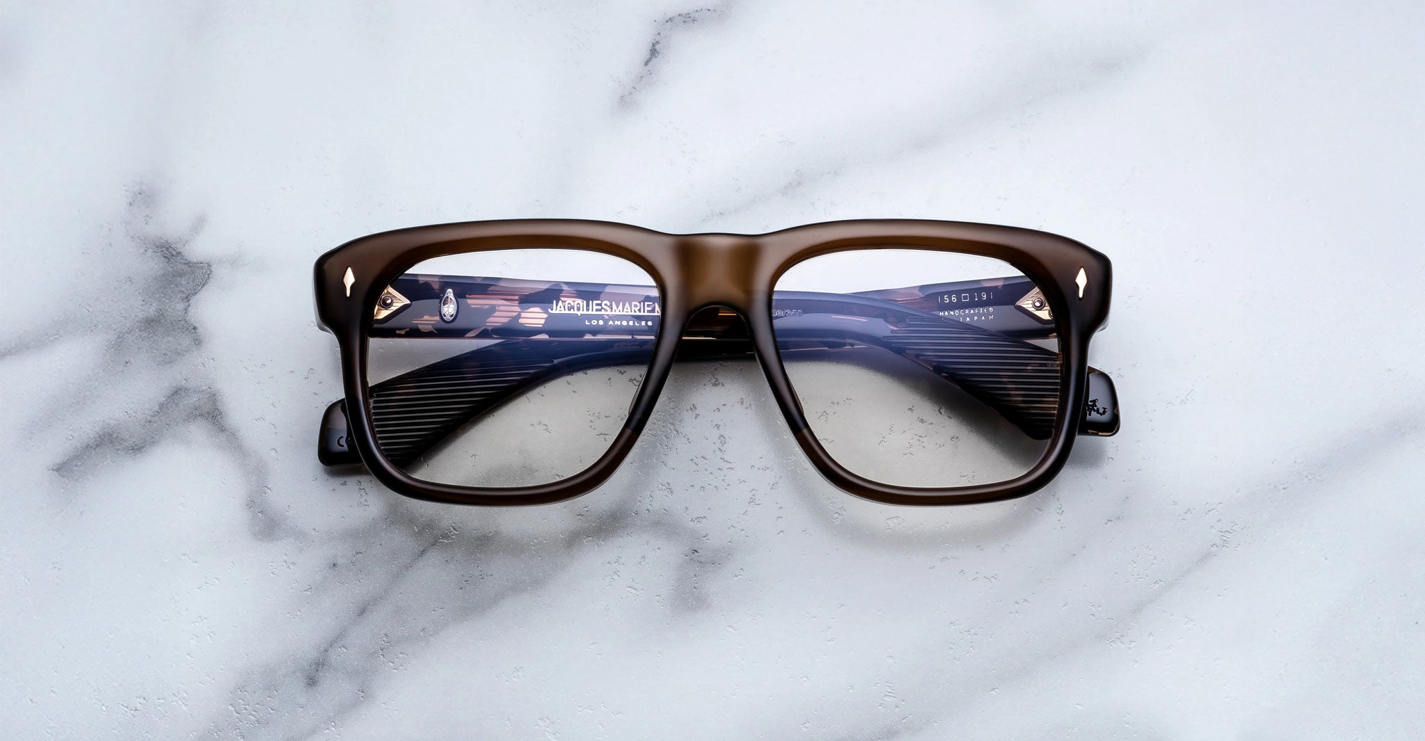 Jacques Marie Mage Yves brown rectangular eyeglasses with thick frames, front view.