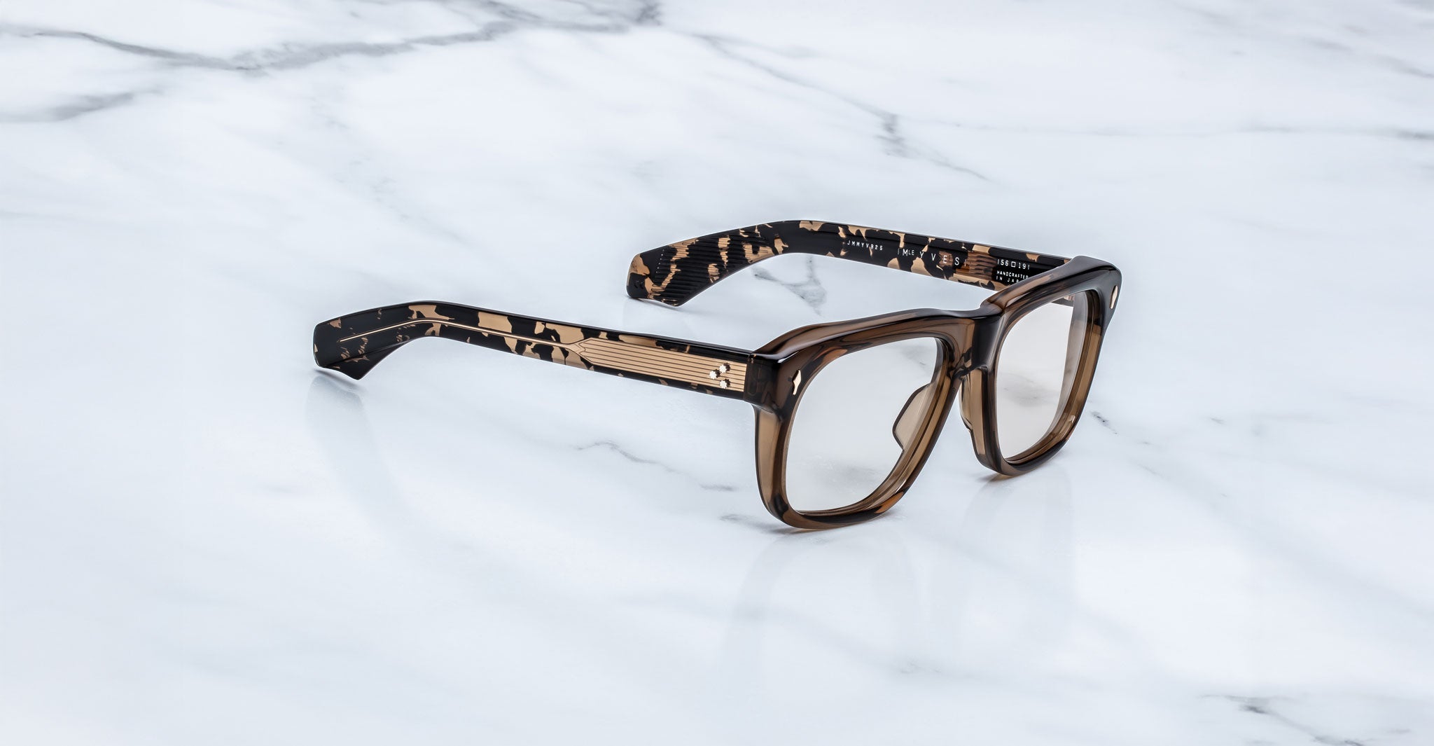 Jacques Marie Mage Yves eyeglasses with thick tortoiseshell frames, front view.