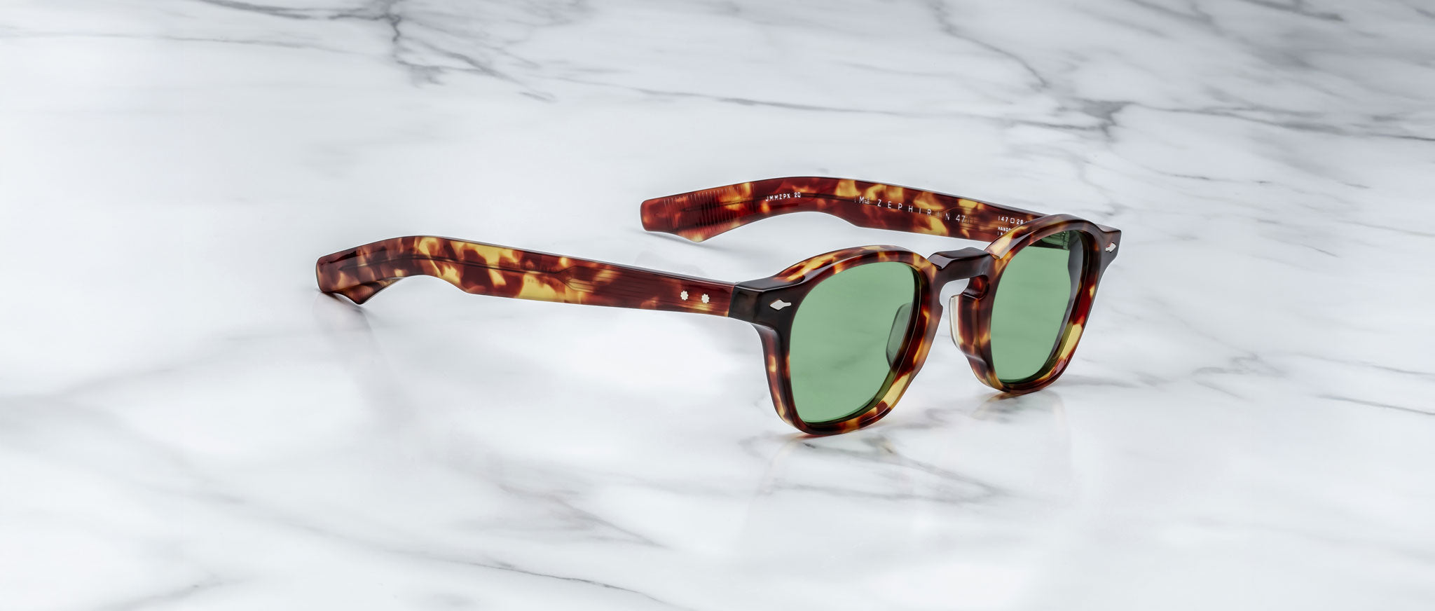 Jacques Marie Mage Zephirin 47 tortoiseshell sunglasses with green lenses, top view.